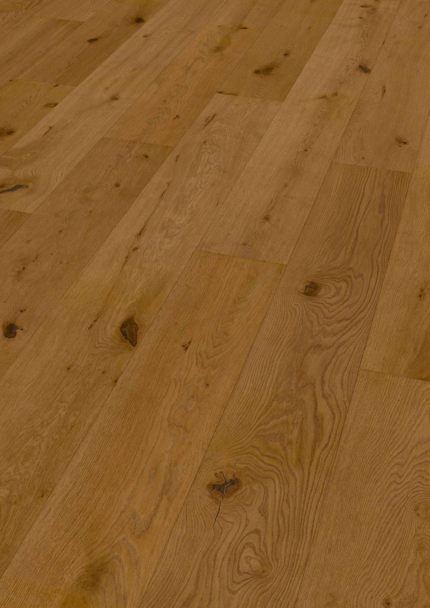 Hochwertige, breite Dielen eines Eichenholz-Bodens mit natürlicher Holzmaserung in Farbtönen von hellbraun bis mittelbraun.